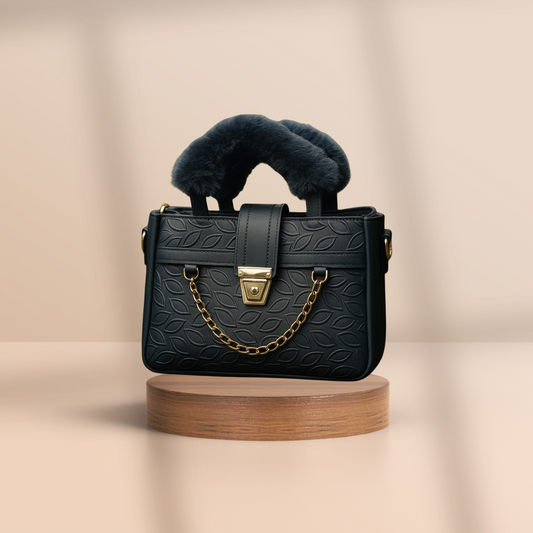 Black handbag with fur accents on a beige background